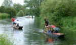 Two punts arrive in Grantchester, but the third pauses as Andy Prevett enjoys a dip.