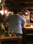 Chris holds court at the bar.