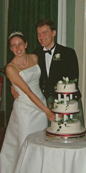 20031010-200614.jpg - Cutting the cake - for real