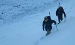 Lottie and Peter ascending the snow slope