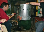 Peter attempts "Bin Cave" whilst onlookers 'assist'