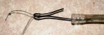 Use the wire to thread some cotton through the tube.