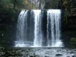Ruth contemplates crossing behind the waterfall