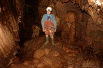 Sarah in a chamber with lovely floor formations