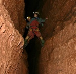 Sarah and Dave straddle 20m of empty black space in the Traverses