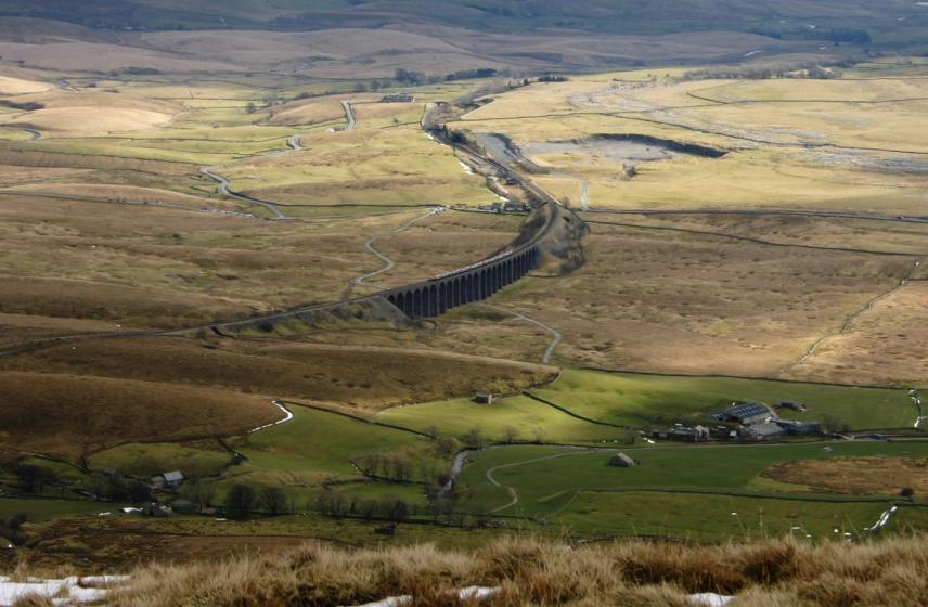 20050312-123744.jpg - Looking down at Ribblehead as a train crosses the viaduct