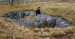 Clare explores a pothole