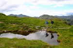 Sarah and Andrew pass a pool on the summit ridge