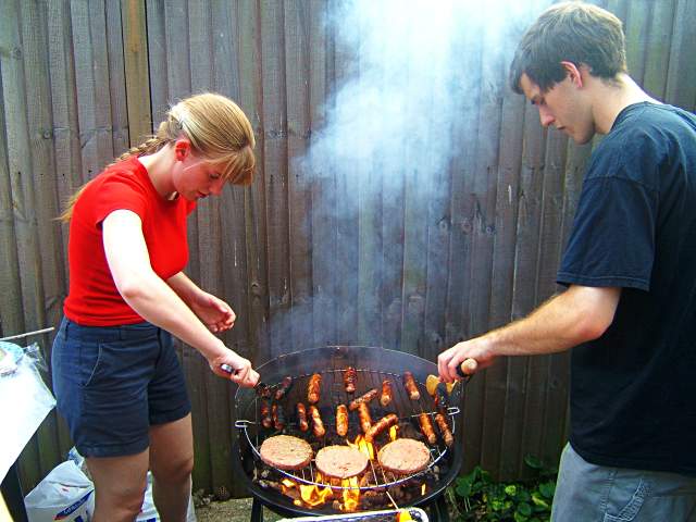 20050626-181136.jpg - Lottie and Tom with food