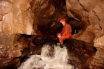 John by a cascade in the main streamway