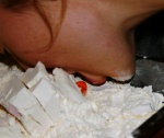 Lisette losing the flour-cake game