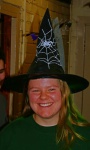 A green-tressed, behatted Helen