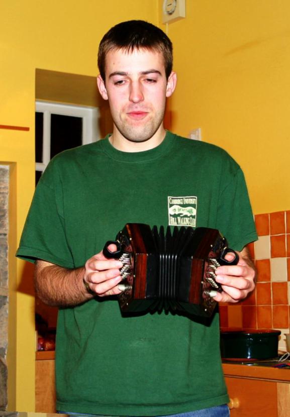 20051231-214554.jpg - Absent a piper, we asked Dave to play concertina