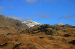 Snowy peaks peek from behind the foothills