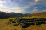 Similar view from above the granaries, with figures for scale