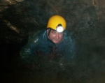 Another caver emerges