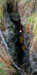 Gaynor disappearing into one of the Parnassus Caves (I think)