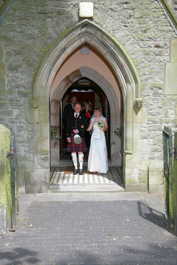20070526-121308.jpg - Peter and Lottie leaving the church