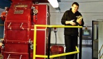 Our guide, Phil, with old and new machinery (and crystal malt)