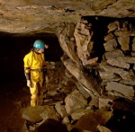 Alison inspects a bulging support wall