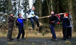 Caroline bends a tree trunk