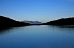 Mountain lake with standing figures