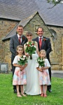Bride and groom with best man and bridesmaids