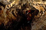 Sarah in the entrance section of High Pasture Cave