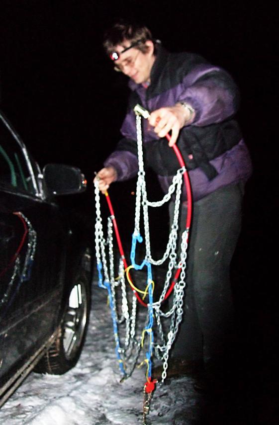 20100102-202046.jpg - Al fits his new chains at last