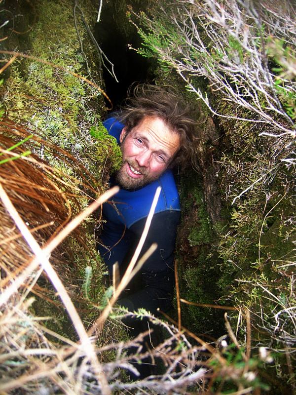 20100507-135224.jpg - Exploring the small rift cave near the summit