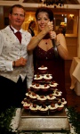 One manic, and one concerned, cake-cutter