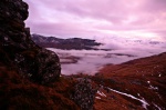 Layers of pink clouds roll in