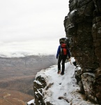 Hannah traverses a sandstone ledge