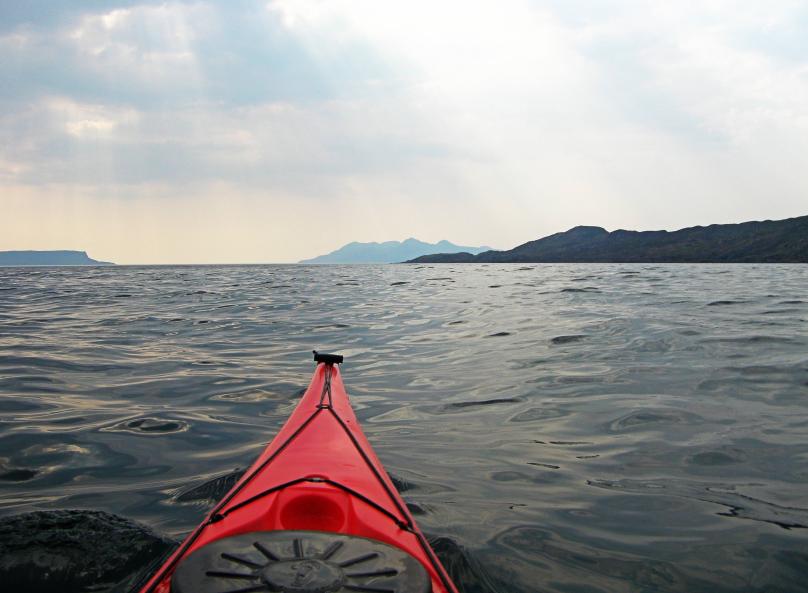 20110429-144301.jpg - Early view of Rum, sneaking out from behind Sleat