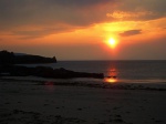 Sinking sun beyond Beinn Mhor and Hecla (South Uist)